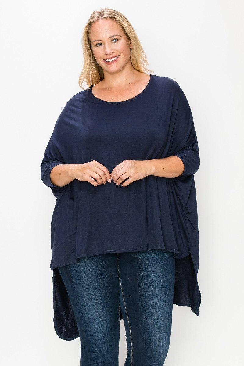 Solid top featuring a round neck, three quarter sleeves, and a high-low hem